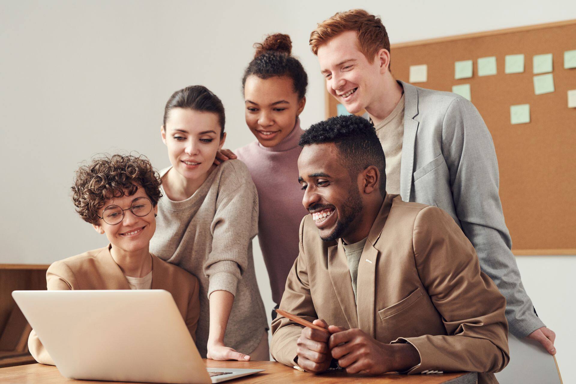 A team reviewing findings together around a laptop
